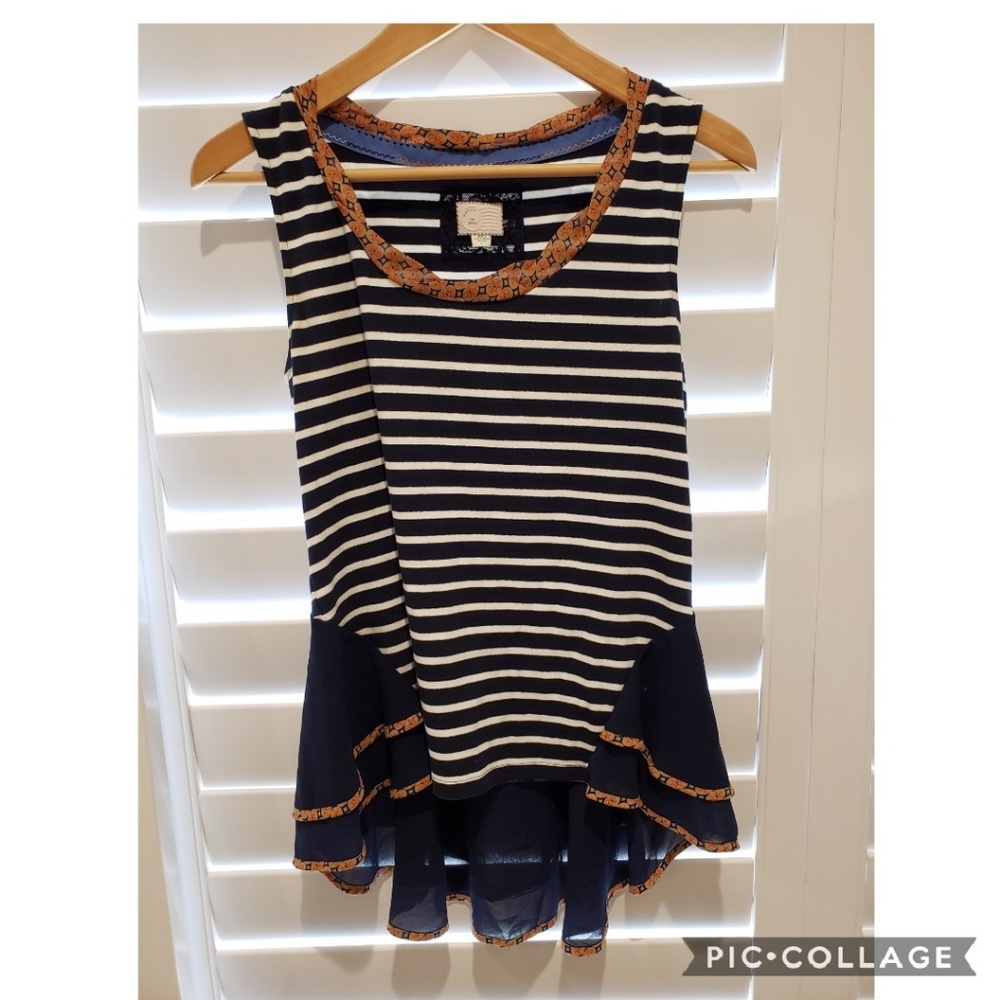 Blue and white striped sleeveless top.